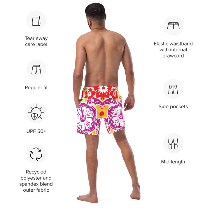 Man wearing Hawaii Blossoms Retro board shorts with floral pattern from behind
