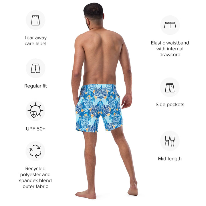 Man wearing HAWAII TURTLES Retro Board Shorts UPF 50+, blue and white patterned from behind