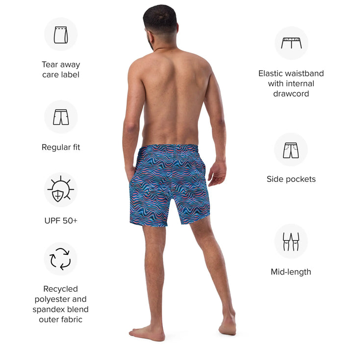 Shirtless man wearing TRIPP WAVES Retro Board Shorts UPF 50+ with blue and purple pattern