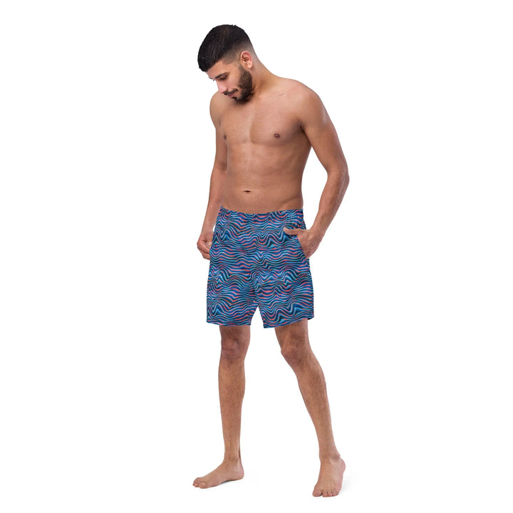 Guy rocking TRIPP WAVES Retro Board Shorts UPF 50+ in blue and purple pattern