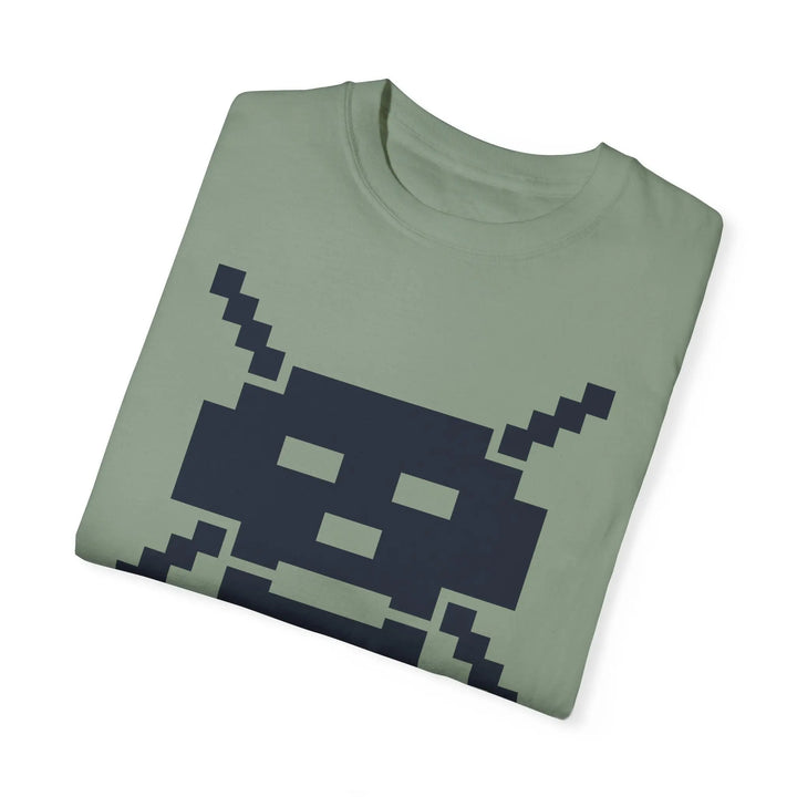 Folded sage green VIVA LA TECHNOLOGIE T-shirt with navy blue pixelated skull design